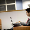 student working on his laptop at the TECH center.